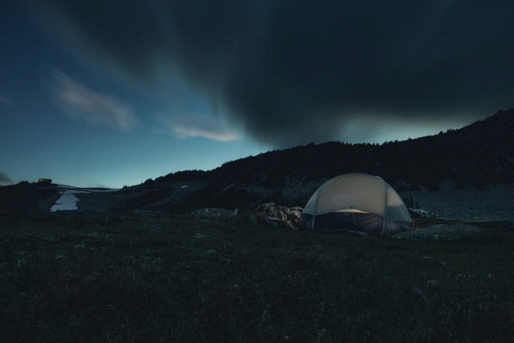 Camping tent at night in the mountains